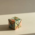 Origami cube with intricate multi-colored patterns, featuring geometric and floral Royalty Free Stock Photo