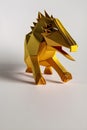 Origami dinosaur on light background