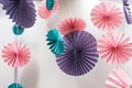 Origami fans wheel - paper craft folding and hanging against white wall Royalty Free Stock Photo