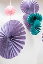 Origami fans wheel - paper craft folding and hanging against white wall Royalty Free Stock Photo