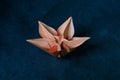 Origami Flower Blossom - Paper Art on Textured Background Royalty Free Stock Photo