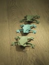 Origami Frogs on wooden background