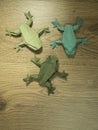 Origami Frogs on wooden background