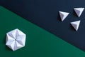 Origami geometric green and black background. Majority and minority concept