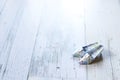 Origami high heels on the white-painted wooden table Royalty Free Stock Photo