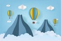 Origami made colorful hot air balloon flying over the mountain with cloud.Paper art style. Royalty Free Stock Photo