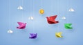 Origami made colorful paper bird flying on blue sky