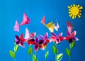 Origami paper flowers, butterflies, clouds and sun. Royalty Free Stock Photo