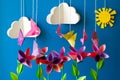 Origami paper flowers, butterflies, clouds and sun. Royalty Free Stock Photo