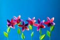 Origami paper flowers, butterflies, clouds and sun. Royalty Free Stock Photo