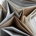 Origami paper folds create sharp, angular patterns in earthy tones including beige, Royalty Free Stock Photo