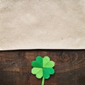 Origami paper green clover shamrock leaf on dark barn wood background Royalty Free Stock Photo