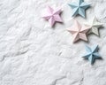 Origami paper stars on crumpled background