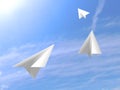 Origami paper white airplanes flying on the sky