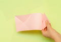 Origami pink heart on a green background, step by step instructions. as great idea for a hand made diy Valentine s Day, Mothers