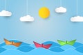 Origami sailing boat in waves. Paper art style background with ship, ocean, sun and clouds. Vector.