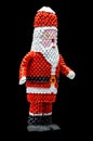 Origami Santa Claus isolated on black background