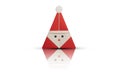 Origami Santa Claus with reflection on white background