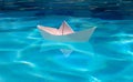 Origami ship. White paper boat into the clear sea water. Royalty Free Stock Photo