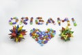 Origami sign and heart creative concept made of bunch of multi colored origami stars