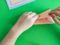 Origami step by step. How to make a paper bunny for Easter greetings