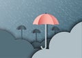 Origami umbrellas with clouds on monsoon background and rainy se Royalty Free Stock Photo