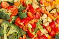 An original background of finely chopped and seasoned vegetables before baking in the oven. Potatoes, bell peppers, squash, Royalty Free Stock Photo