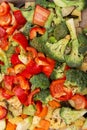 An original background of finely chopped and seasoned vegetables before baking in the oven. Potatoes, bell peppers, squash, Royalty Free Stock Photo