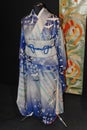 A original blue Japanese women's kimono decorated with flowers and cranes