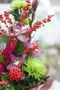 Original bouquet of flowers from gerberas, Burgundy roses, orchids, tulips Royalty Free Stock Photo