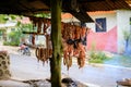 Original Caribbean food on the roadside in the Dominican Republic. Smoked pork, morcillas and longanizas. Royalty Free Stock Photo