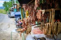 Original Caribbean food on the roadside in the Dominican Republic. Smoked pork, morcillas and longanizas. Royalty Free Stock Photo