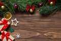 Original Christmas angled exposition with two gift box, snowflake, star, firtree, slice of lemon on the wooden Royalty Free Stock Photo