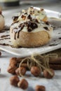 Original cinnabon rolls with chocolate-cream sauce and hazelnuts Royalty Free Stock Photo