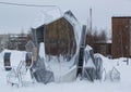 An original composition in the form of a table and chairs in the Geologists \' Square in the city of Noyabrsk in winter Royalty Free Stock Photo