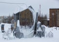 An original composition in the form of a table and chairs in the Geologists \' Square in the city of Noyabrsk in winter