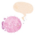 A creative cartoon blowfish and speech bubble in retro textured style Royalty Free Stock Photo