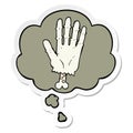 A creative cartoon zombie hand and thought bubble as a printed sticker Royalty Free Stock Photo