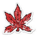 A creative distressed sticker of a cartoon marijuana leaf Royalty Free Stock Photo