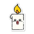 A creative distressed sticker of a cute cartoon lit candle
