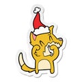 A creative laughing fox sticker cartoon of a wearing santa hat