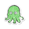 A creative retro distressed sticker of a cartoon alien squid face