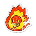 A creative retro distressed sticker of a cartoon burning skull