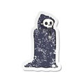 A creative retro distressed sticker of a cartoon spooky halloween costume Royalty Free Stock Photo