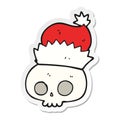A creative sticker of a cartoon skull wearing christmas hat