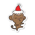 A creative sticker cartoon of a suspicious monkey wearing santa hat