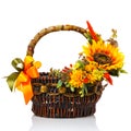 Original dark brown wicker basket with floral arrangements. Great scenery with yellow flowers, greenery and a large sunflower Royalty Free Stock Photo