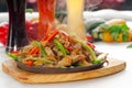 Original fajita sizzling hot on iron plate