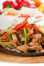 Original fajita sizzling hot on iron plate