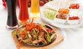 Original fajita sizzling hot on iron plate